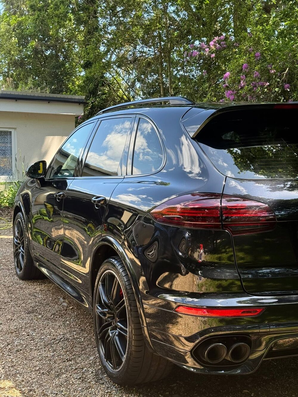 Black Porsche Cayenne GTS with a deep gloss finish after a full valet